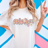 Women's graphic t-shirt by Comfort Colors featuring a retro "Aloha" summer design. This soft and comfortable tee is perfect for adding a touch of tropical flair to your summer wardrobe.