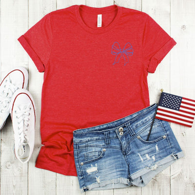 Bella Canvas tee featuring a patriotic bow design for the 4th of July. This soft, comfortable t-shirt is perfect for celebrating Independence Day with style and flair.