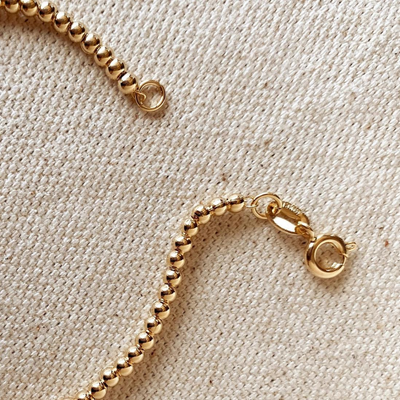 Add a touch of sophistication with our 18k Gold Filled 2.5mm Beaded Bracelet, featuring finely crafted beads for a timeless and elegant design. Perfect for any occasion, this versatile piece complements any outfit effortlessly.