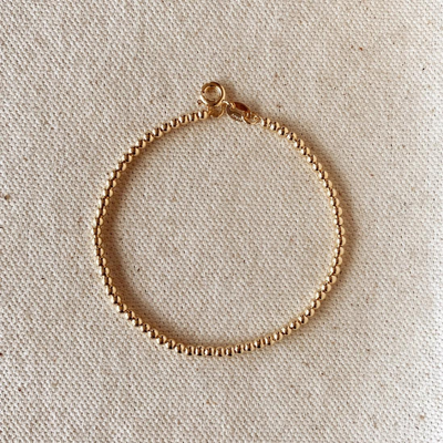 Add a touch of sophistication with our 18k Gold Filled 2.5mm Beaded Bracelet, featuring finely crafted beads for a timeless and elegant design. Perfect for any occasion, this versatile piece complements any outfit effortlessly.