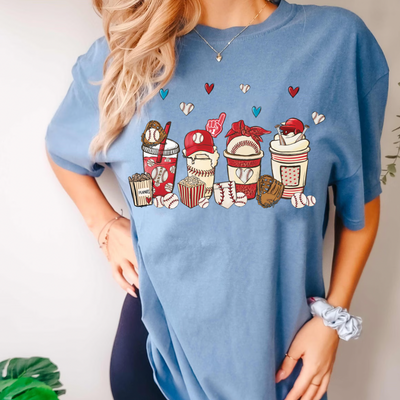 A women's graphic t-shirt with short sleeves, featuring Baseball Lattes design. This soft, comfortable short sleeve tee from Comfort Colors is perfect when watching your favorite Baseball game. It is available in white with pink font or pink with white font, in sizes Small to 2XL.