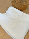 A women's embroidered crewneck sweatshirt with the word "Bride" elegantly stitched on the front. This soft and comfortable white sweatshirt is perfect for the bride-to-be as she prepares for her big day. Available in unisex sizes Small to Extra Large, made from a preshrunk 50/50 cotton and polyester blend.