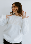 A women's embroidered crewneck sweatshirt with the word "Bride" elegantly stitched on the front. This soft and comfortable white sweatshirt is perfect for the bride-to-be as she prepares for her big day. Available in unisex sizes Small to Extra Large, made from a preshrunk 50/50 cotton and polyester blend.